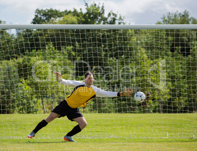 Goalkeeper diving to save the goal