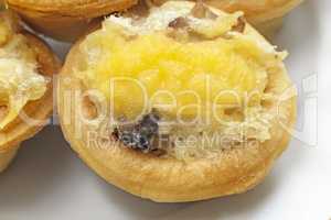 Tartlets with cheese stuffing close-up.