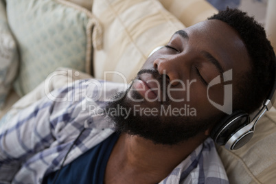 Man sleeping while listening to music