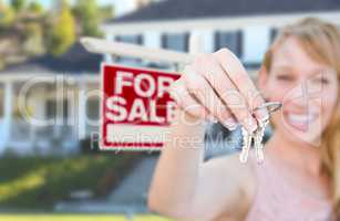 Excited Woman Holding House Keys and For Sale Real Estate Sign i