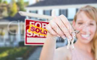 Excited Woman Holding House Keys and Sold For Sale Real Estate S