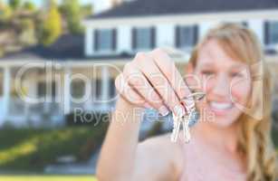Excited Female Holding House Keys in Front of Nice New Home.