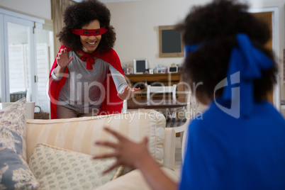 Mother and daughter pretending to be superhero