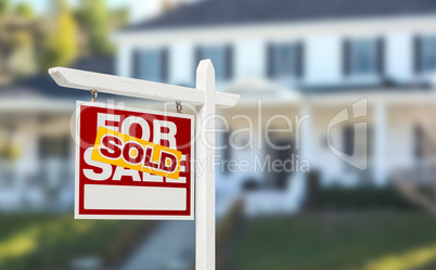 Sold Home For Sale Real Estate Sign in Front of Beautiful New Ho
