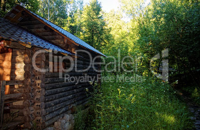 wooden Orthodox Church in the forest in summer
