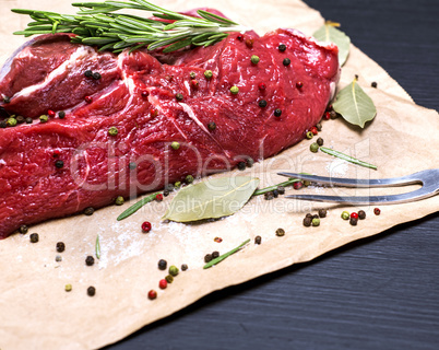 raw beef tenderloin on brown kraft paper