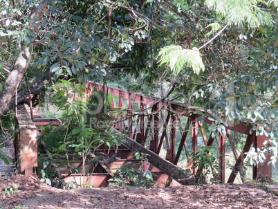 Abandoned iron bridge in the middle of the woods