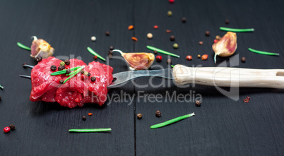 pieces of beef strung on a kitchen fork