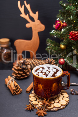 hot chocolate with marshmallow slices in a brown ceramic mug