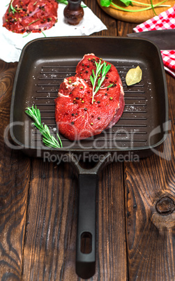 piece of raw beef with spices