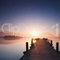 boardwalk leads out onto the lake, silent at lake while sunrise