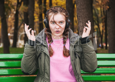Surprised young girl with headphones