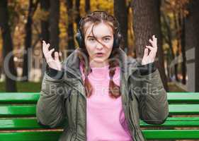 Surprised young girl with headphones