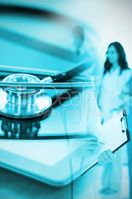 Composite image of stethoscope on digital tablet