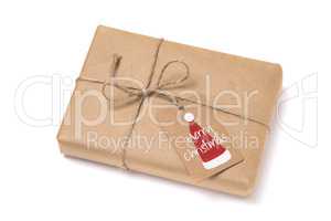 Christmas gift box wrapped in kraft paper.