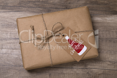Christmas or New Year gift box wrapped in kraft paper with blank