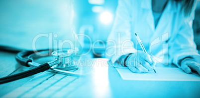 Composite image of close-up of keyboard with stethoscope