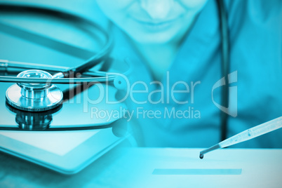 Composite image of stethoscope on digital tablet