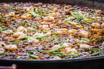 Paella dish with shrimp, closeup.