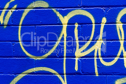 Grunge blue brick background with abstract yellow pattern.