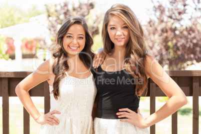 Two Mixed Race Girlfriends Pose for Portrait Outdoors