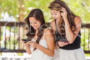 Two Expressive Mixed Race Girlfriends Using Their Smart Cell Pho