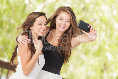 Two Attractive Mixed Race Girlfriends Using Their Smart Cell Pho