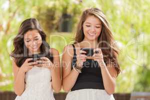 Two Expressive Mixed Race Girlfriends Using Their Smart Cell Pho