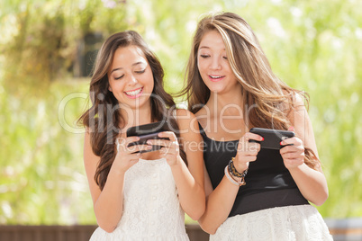 Two Expressive Mixed Race Girlfriends Using Their Smart Cell Pho