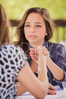 Concerned Young Adult Woman Talking With Her Friend