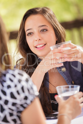 Expressive Young Adult Woman Having Drinks and Talking with Her