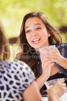 Expressive Young Adult Woman Having Drinks and Talking with Her