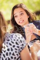 Expressive Young Adult Woman Having Drinks and Talking with Her