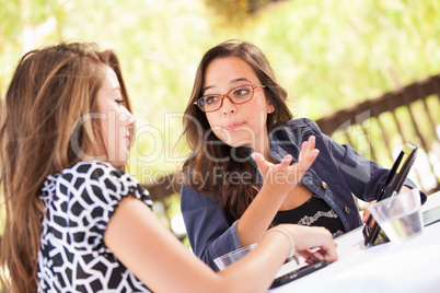 Expressive Young Adult Girlfriends Using Their Computer Electron