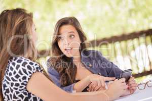 Expressive Young Adult Girlfriends Using Their Smart Cell Phone