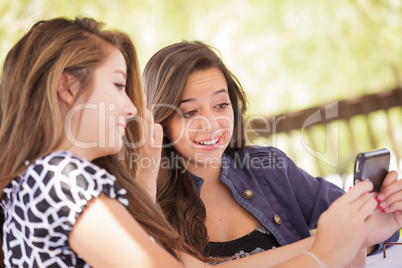 Expressive Young Adult Girlfriends Using Their Smart Cell Phone