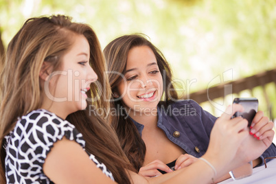 Expressive Young Adult Girlfriends Using Their Smart Cell Phone