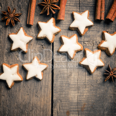 Sweet cinnamon stars on a wooden table with space for text