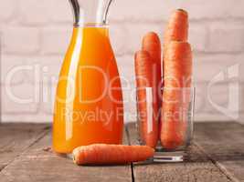 Juice with organic carrots on a table