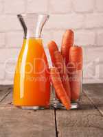 Juice with organic carrots on a table