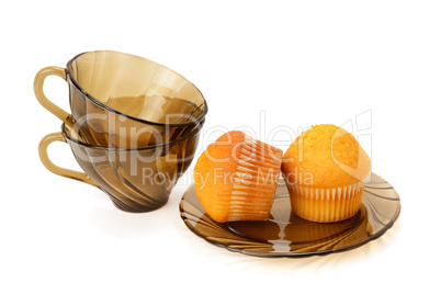 Cupcakes and cups isolated on white background