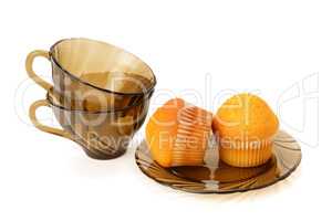 Cupcakes and cups isolated on white background