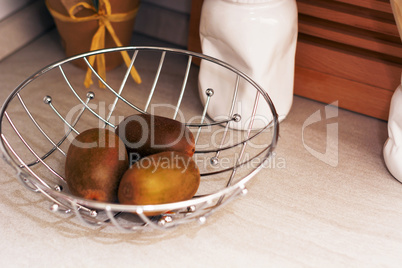 kiwis in a metallic basket