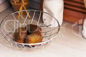 kiwis in a metallic basket