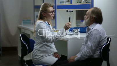 Woman doctor inspecting patient's nervous system