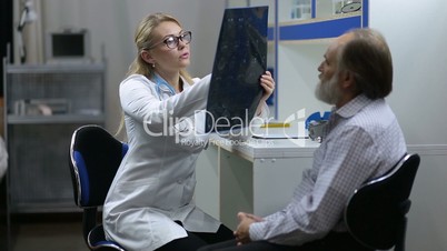Doctor holding MRI scan in diagnostic hospital