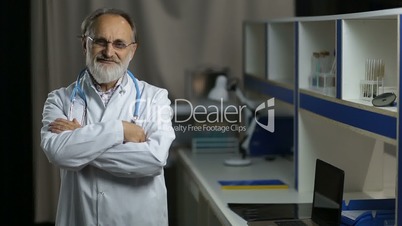 Portrait of friendly senior male doctor smiling
