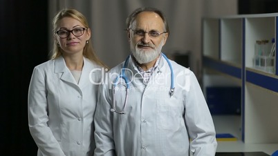 Portrait of smiling doctos in hospital office