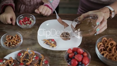 Three generation family making chocolate cookies