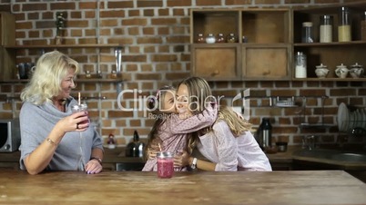 Loving daughter embracing mother in the kitchen